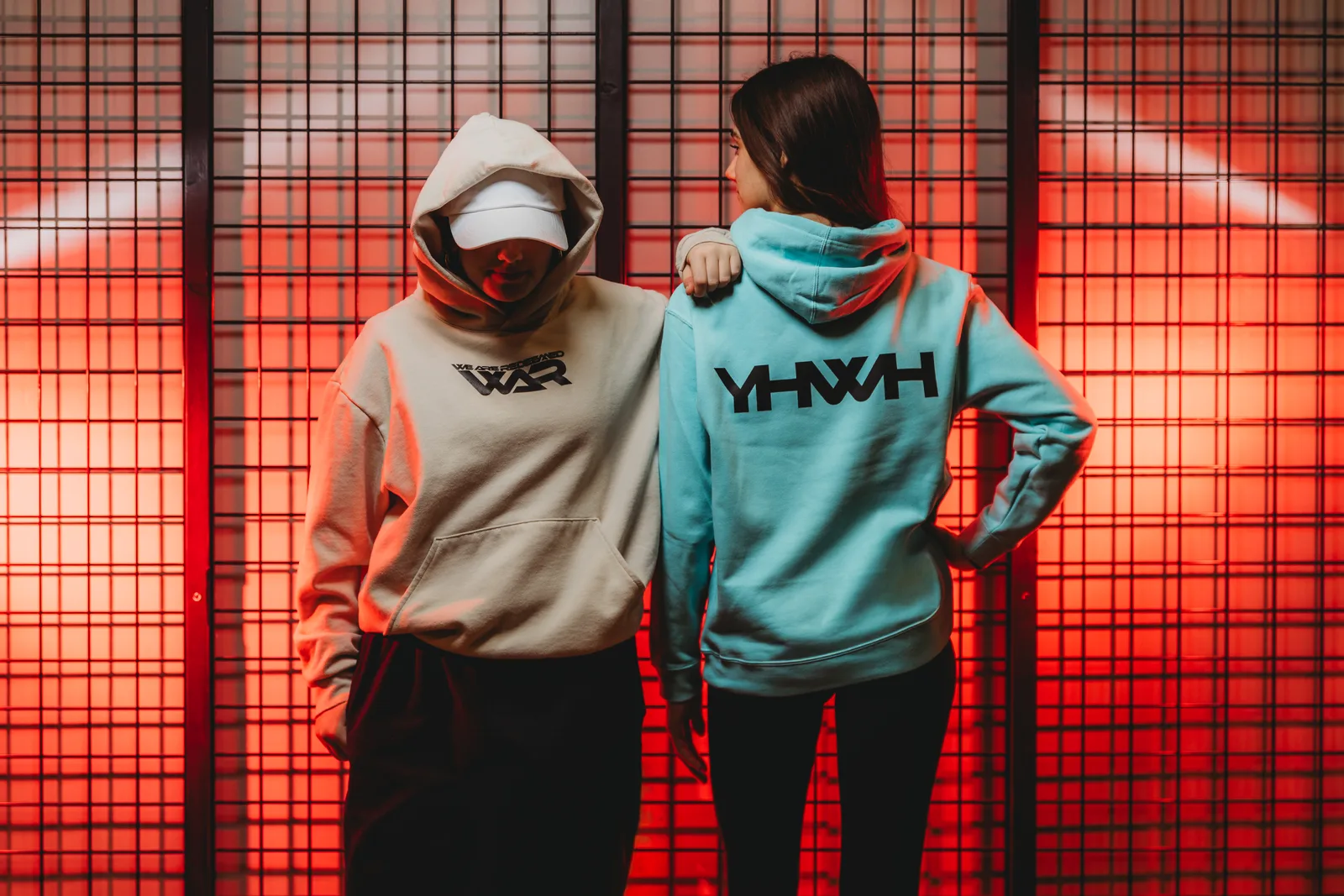 Pair wearing We Are Redeemed hoodies